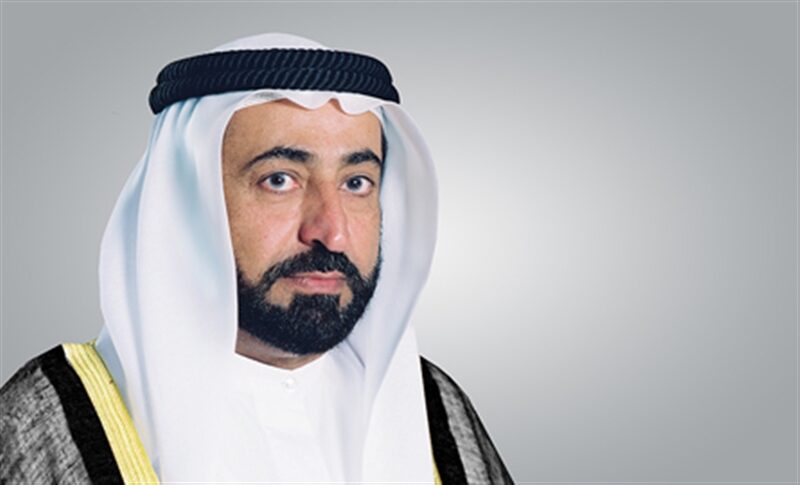 Studio portrait of Sultan Muhammad Al Qasimi from earlier in his tenure, wearing a dark bisht