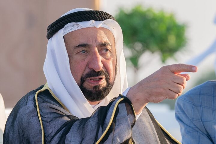 Sultan Muhammad Al Qasimi gesturing while speaking during an outdoor engagement