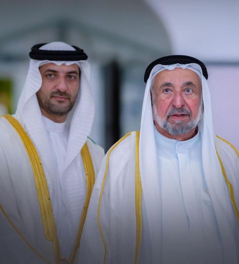 Sultan Muhammad Al Qasimi photographed alongside an official at a formal engagement